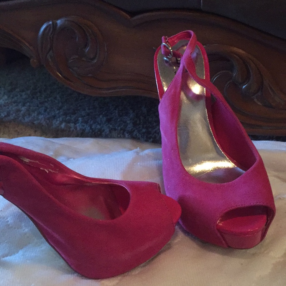 Fuschia suede platform slingback pumps.